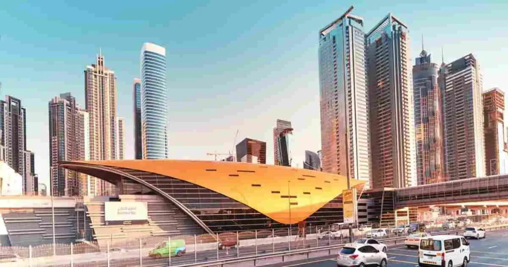 Dubai Marina skyline with modern skyscrapers and metro station highlighting areas popular with Australians buying property in Dubai.
